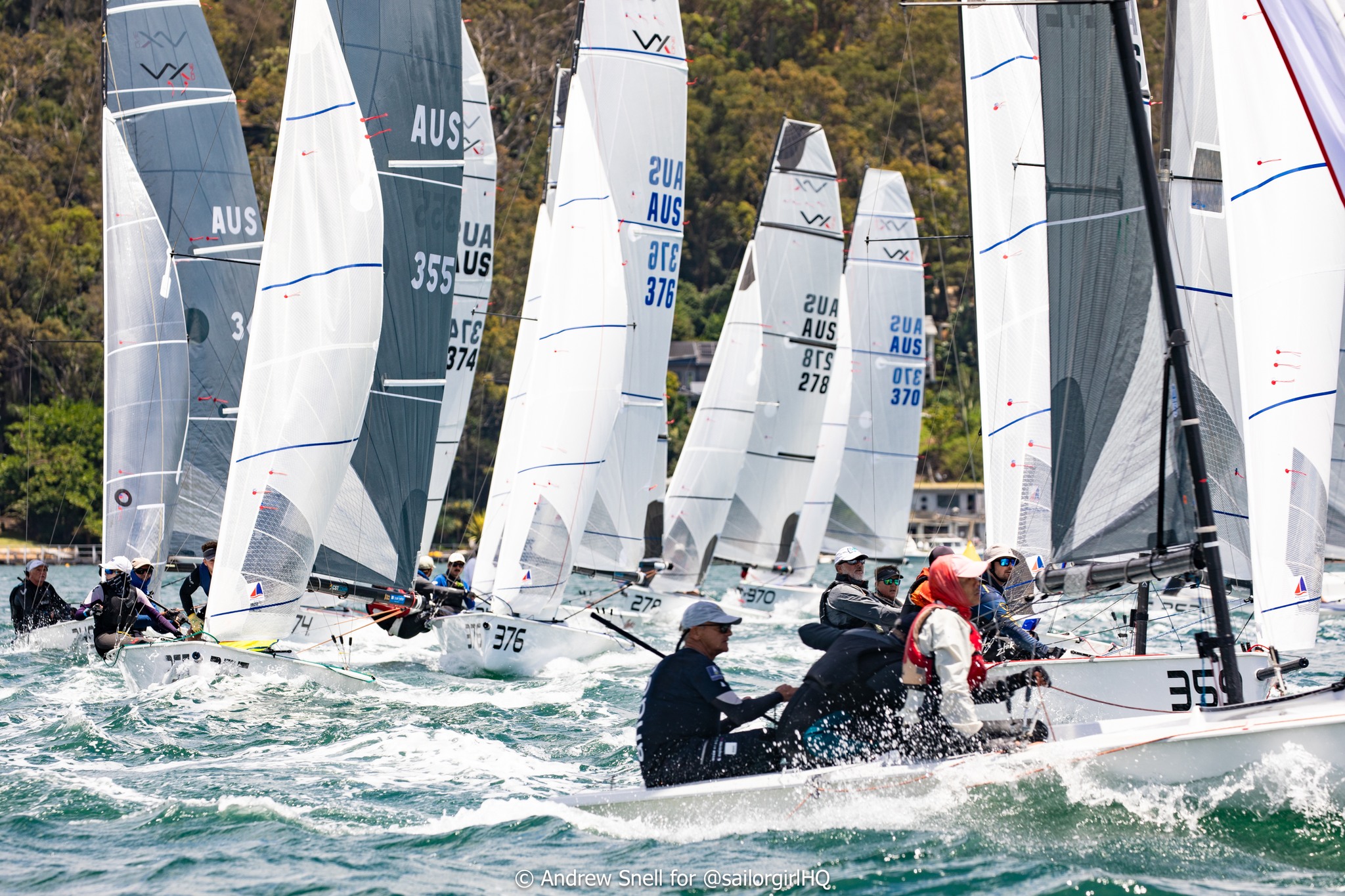 May be an image of 4 people, people boat racing, sail, sailing boat and text